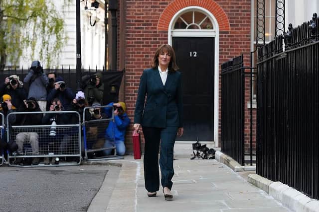 Britain's Chancellor of the Exchequer Rachel Reeves carries the red Budget Box as she walks away from 11 Downing Street, in central London, on November 26, 2025, en-route to the Houses of Parliament to present the government's annual Budget. (Photo by Frank Augstein / POOL / AFP via Getty Images)