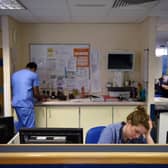 Staff at computers in an A&E department. Picture: OLI SCARFF/AFP via Getty Images