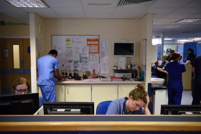 Staff at computers in an A&E department. Picture: OLI SCARFF/AFP via Getty Images