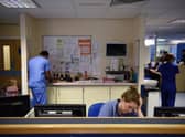 Staff at computers in an A&E department. Picture: OLI SCARFF/AFP via Getty Images