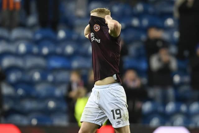 Hearts' Alex Cochrane looks dejected at full time following the defeat by Rangers.