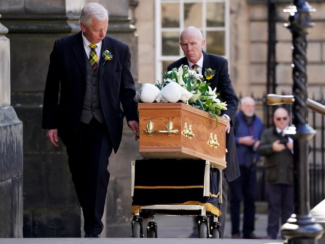 A pair of white boxing gloves rest on the coffin of former boxer Ken Buchanan at St Giles' Cathedral, Edinburgh, ahead of a memorial service. The Scottish boxing great, who became the undisputed world lightweight champion in 1971, died at the beginning of the month, aged 77