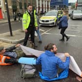 Handout photo issued by Just Stop Oil of activists blocking the road on Commercial Street in east London. Issue date: Sunday October 30, 2022.