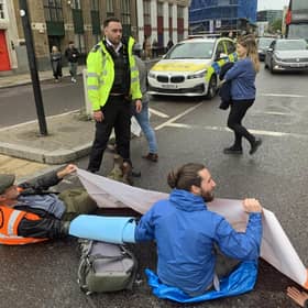 Handout photo issued by Just Stop Oil of activists blocking the road on Commercial Street in east London. Issue date: Sunday October 30, 2022.