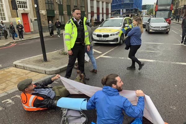 Handout photo issued by Just Stop Oil of activists blocking the road on Commercial Street in east London. Issue date: Sunday October 30, 2022.