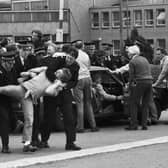 Members of the NUM miners' union picket line clash with police outside Bilston Glen colliery during the miners strike in June 1984.