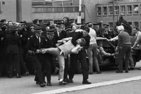 Members of the NUM miners' union picket line clash with police outside Bilston Glen colliery during the miners strike in June 1984.