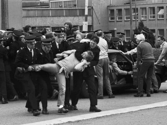Members of the NUM miners' union picket line clash with police outside Bilston Glen colliery during the miners strike in June 1984.
