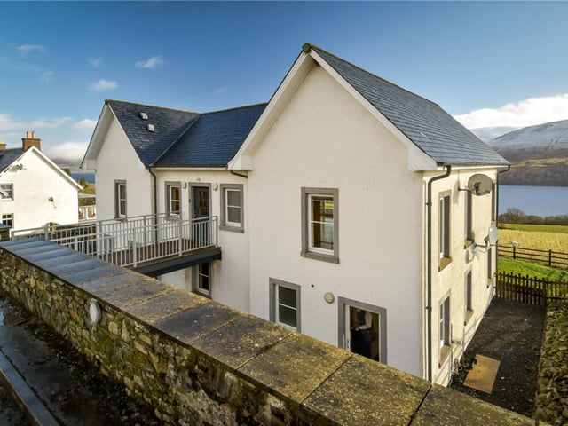Rear of property showing walkway to main entrance.