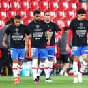 Players from Spanish side Granada protest against the European Super League. (Photo by Fran Santiago/Getty Images)