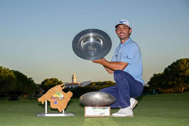 Marco Penge celebrates with his trophies after winning the Rolex Challenge Tour Grand Final supported by The R&A and also the Road to Mallorca Rankings. Picture: Octavio Passos/Getty Images.