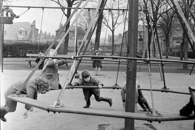 Children can be playing on the roundabout in St Margaret's Park Corstorphine in 1964.