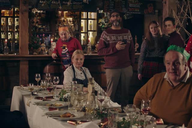 Christmas Dinner in Lost at Christmas, in the Clachaig Inn, Glencoe, from left to right, Sylvester McCoy, Frazer Hines, Clare Grogan, Sanjeev Kohli, Caitlin Blackwood, Alexander Teunion, Alasdair McCrone, Kenny Boyle and Karen Bartke.