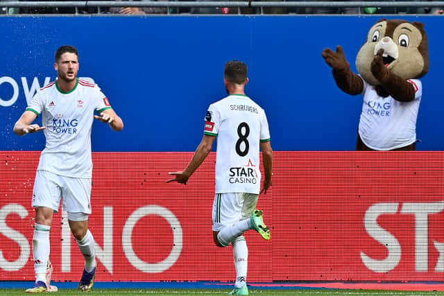 Henry, left, celebrates his goal against Charleroi