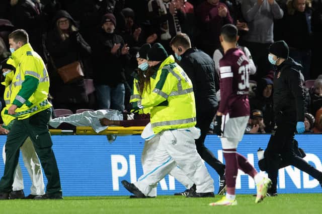 Hearts' Beni Baningime leaves the filed on a stretcher.