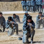 Newly recruited Taliban fighters  display their skills during a graduation ceremony at the Abu Dujana National Police Training centre in Kandahar on February 9, 2022. (Photo by Javed TANVEER / AFP) (Photo by JAVED TANVEER/AFP via Getty Images)