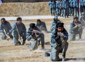Newly recruited Taliban fighters  display their skills during a graduation ceremony at the Abu Dujana National Police Training centre in Kandahar on February 9, 2022. (Photo by Javed TANVEER / AFP) (Photo by JAVED TANVEER/AFP via Getty Images)