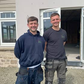 Kris Main and colleague Cameron Martin, working on a heat pump installation near Cupar, Fife