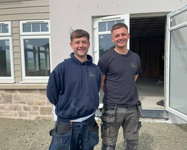 Kris Main and colleague Cameron Martin, working on a heat pump installation near Cupar, Fife