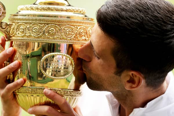 Novak Djokovic of Serbia kisses the trophy after defeating Matteo Berrettini to win Wimbledon last year.