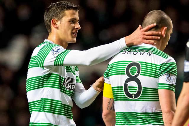 Aleksandar Tonev claps Celtic captain Scott Brown, who says he "stuck up" for the Bulgarian over his 2014 racial abuse of soon-to-be Aberdeen team-mate Shay Logan because Tonev "swore he didn't do it". [Photo by Sammy Turner/SNS Group).