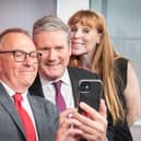 The newly elected leader of Plymouth council, Tudor Evans takes a selfie photograph with Labour leader Sir Keir Starmer and deputy Labour Party leader Angela Rayner