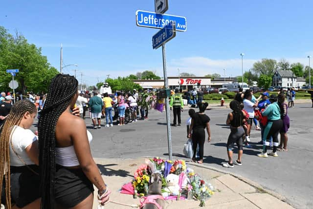 Mourners gather near a Tops Grocery store in Buffalo, New York, following the weekend shooting.