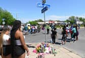 Mourners gather near a Tops Grocery store in Buffalo, New York, following the weekend shooting.