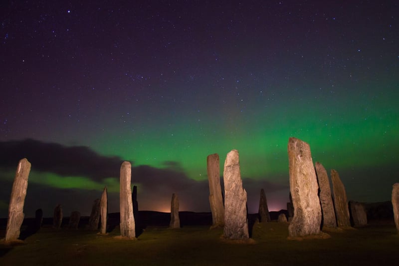 Another island destination offering the perfect combination of dark skies and a northern latitude is the Outer Hebrides. For a truly magical experience, try to see them over the atmospheric Callanish Standing Stones on Lewis.