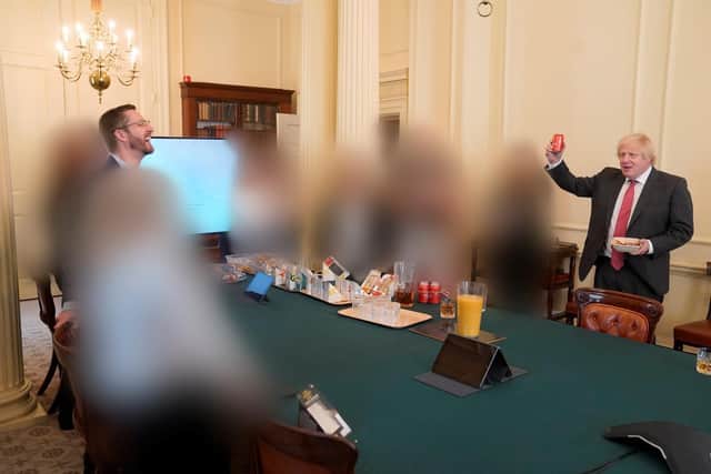 Prime Minister Boris Johnson (right) at a gathering in the Cabinet Room in 10 Downing Street on his birthday, which was released with the publication of Sue's Gray report into Downing Street parties in Whitehall during the coronavirus lockdown. Lord Geidt has stepped down from his position as Boris Johnson's adviser on ministers' interests. Issue date: Thursday June 16, 2022.