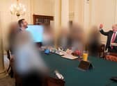 Prime Minister Boris Johnson (right) at a gathering in the Cabinet Room in 10 Downing Street on his birthday, which was released with the publication of Sue's Gray report into Downing Street parties in Whitehall during the coronavirus lockdown. Lord Geidt has stepped down from his position as Boris Johnson's adviser on ministers' interests. Issue date: Thursday June 16, 2022.