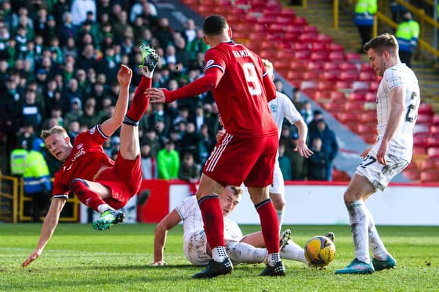 Hibs defender Ryan Porteous was sent off for a tackle on Ross McCrorie in the box.