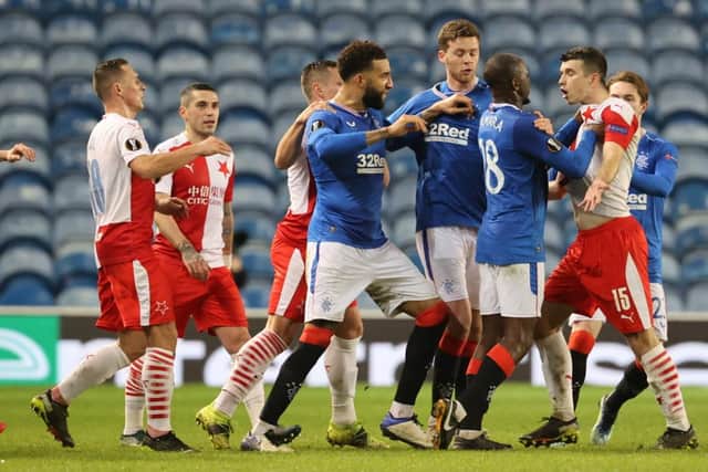 Rangers and Slavia Prague players clash after Ondrej Kudela's alleged comments to Glen Kamara during the UEFA Europa League round of 16 second leg match at Ibrox (Photo by Alan Harvey / SNS Group)