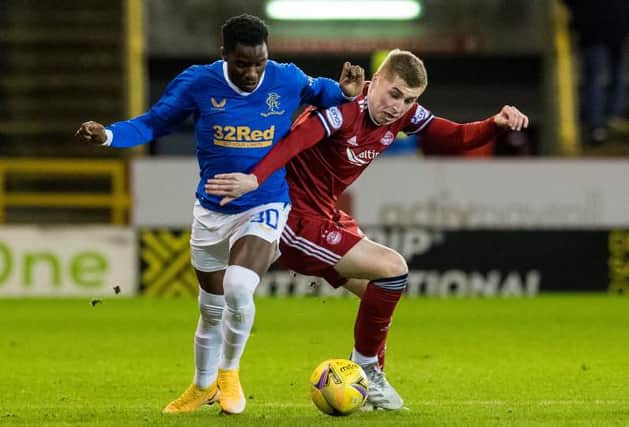 Rangers striker Fashion Sakala (left) tussles with Aberden's Dean Campbell during the 1-1 draw between the sides at Pittodrie last week. (Photo by Ross Parker / SNS Group)