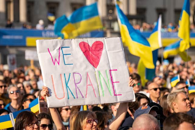 People take part in a solidarity march in London for Ukraine, following the Russian invasion.