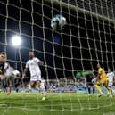 Scott McTominay heads home Scotland's opening goal in Larnaca against Cyprus.