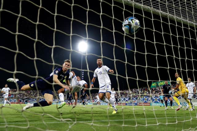 Scott McTominay heads home Scotland's opening goal in Larnaca against Cyprus.