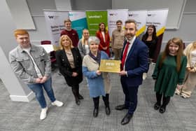 Staff and young people at Wheatley Group with Chair of Wheatley Group  Jo Armstrong and Group Chief Executive Steven Henderson holding IIYP Gold Award.