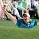 Rory McIlroy celebrates after holing out from a bunker on the 72nd hole in last year's Masters to finish second behind Scottie Scheffler. Picture: Gregory Shamus/Getty Images.