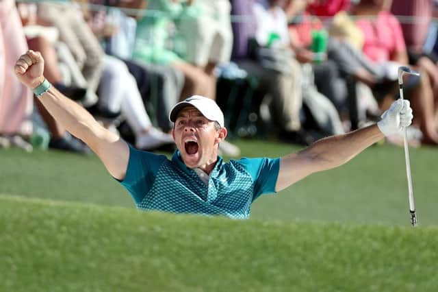 Rory McIlroy celebrates after holing out from a bunker on the 72nd hole in last year's Masters to finish second behind Scottie Scheffler. Picture: Gregory Shamus/Getty Images.