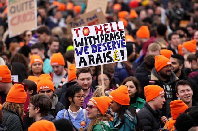 Crowds gather as people take part in a junior doctor's strike in Trafalgar Square. (Photo by Carl Court/Getty Images)