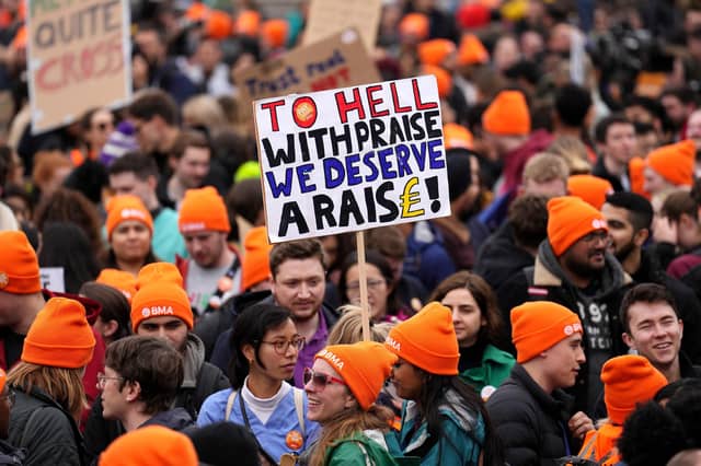 Crowds gather as people take part in a junior doctor's strike in Trafalgar Square. (Photo by Carl Court/Getty Images)
