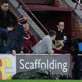 Referee Craig Napier goes to the VAR machine during a cinch Premiership match between Hearts and Livingston.