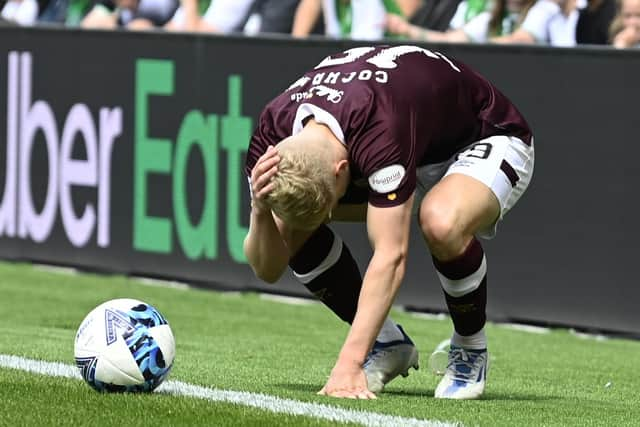 Alex Cochrane of Hearts is hit by objects thrown from the Hibs support during the Edinburgh derby at Easter Road. (Photo by Rob Casey / SNS Group)