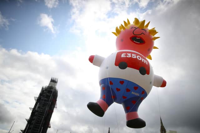 A blimp depicting Boris Johnson flies over London ahead of a pro-EU march (Picture: Aaron Chown/PA Wire)