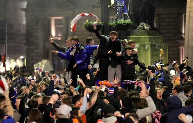 Rangers fans celebrate in George Square after Rangers win the Scottish Premiership title picture: Jane Barlow/PA