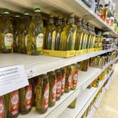 Cooking oil on shelves in a Sainsbury's store in Kent. Supermarkets across the UK have placed limits on how much cooking oil customers can buy due to supply-chain problems caused by Russia's invasion of Ukraine. (Photo credit: Gareth Fuller/PA Wire).