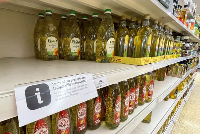 Cooking oil on shelves in a Sainsbury's store in Kent. Supermarkets across the UK have placed limits on how much cooking oil customers can buy due to supply-chain problems caused by Russia's invasion of Ukraine. (Photo credit: Gareth Fuller/PA Wire).