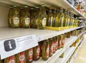 Cooking oil on shelves in a Sainsbury's store in Kent. Supermarkets across the UK have placed limits on how much cooking oil customers can buy due to supply-chain problems caused by Russia's invasion of Ukraine. (Photo credit: Gareth Fuller/PA Wire).