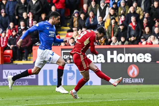 Aberdeen's Bojan Miovski slots home the opener against Rangers. (Photo by Rob Casey / SNS Group)